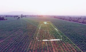 Aerial survey drone capturing terrain and boundary data across a large open property