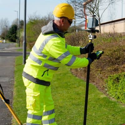 Gps survey equipment field setup - ALTA SURVEY Minneapolis Technician using GPS equipment during land surveying fieldwork