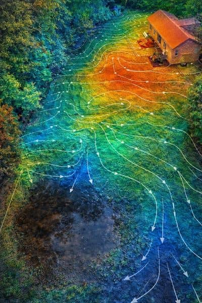 Elevation map drainage analysis - ALTA SURVEY Minneapolis Color-coded elevation map showing how lidar mapping helps track water flow and identify low areas in a residential yard