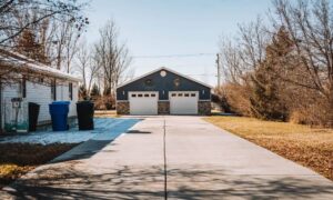 Detached double garage with a wide driveway, illustrating the placement and access considerations a residential land survey can help clarify